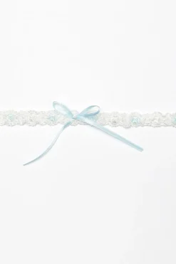 Strumpfband mit blauer Schleife und kleinem Strass-Stein