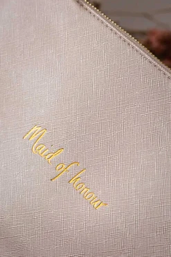 Vegane Clutch mit goldenem Schriftzug 